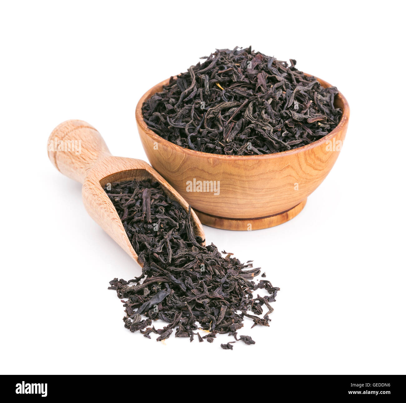 Black tea dry leaves in a wooden bowl isolated on white Stock Photo Alamy