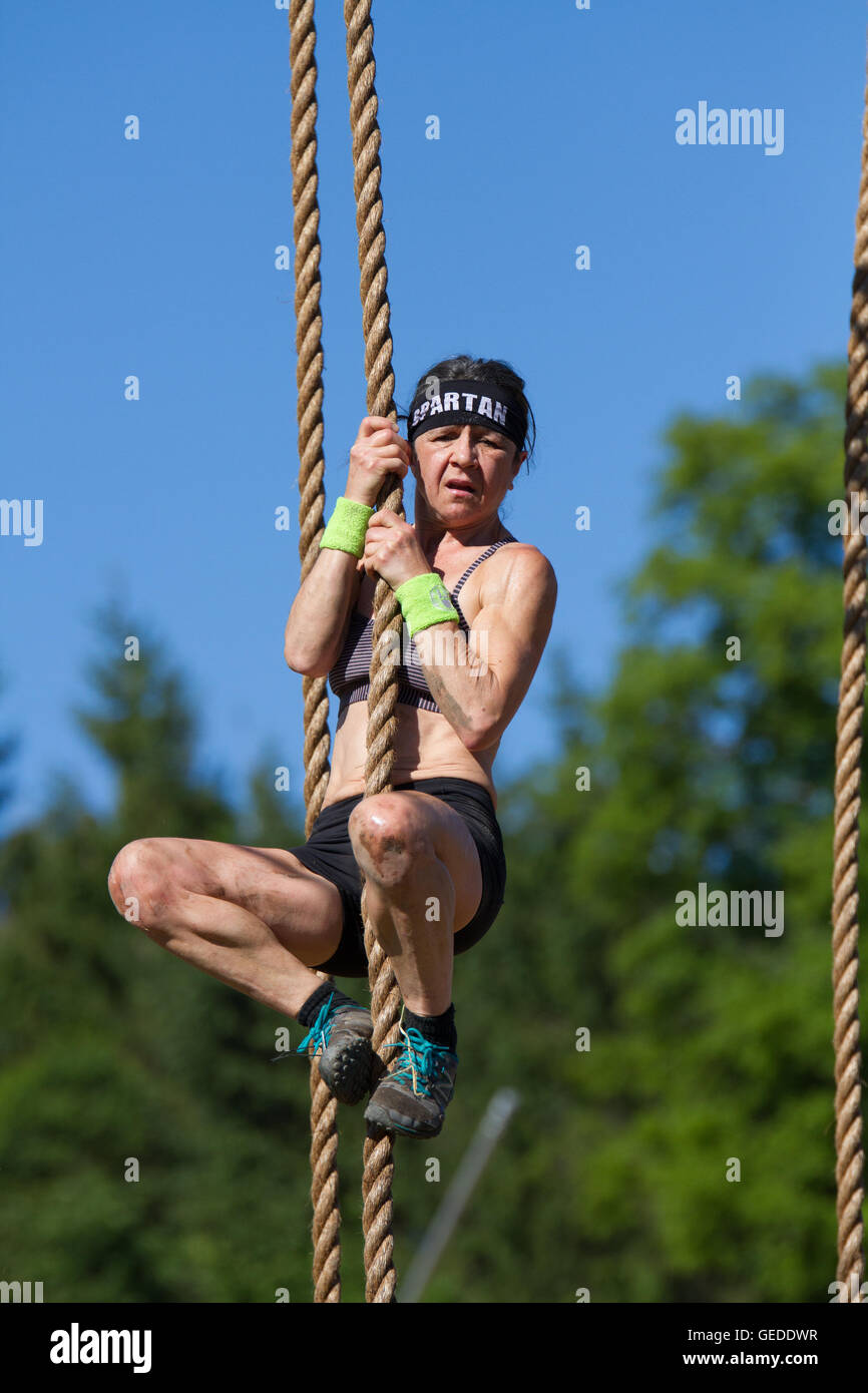 old woman holding rope mid-air Stock Photo