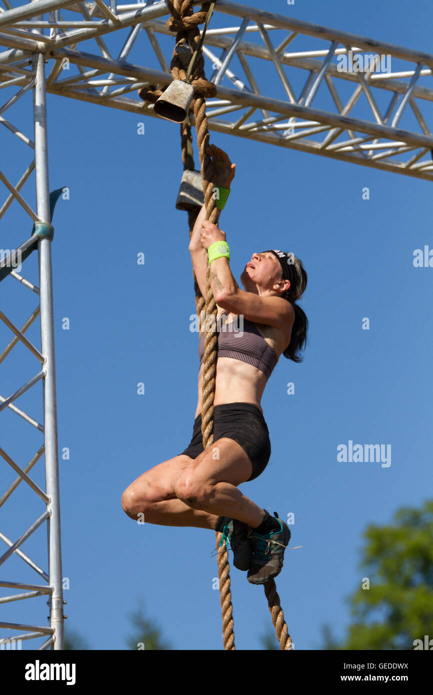 old woman climbing rope Stock Photo