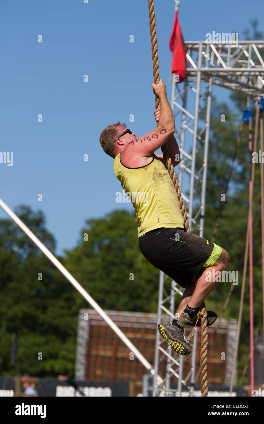middle age man rope climbing outdoor Stock Photo