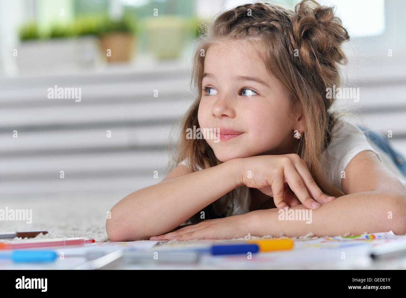 Little girl drawing at class Stock Photo - Alamy