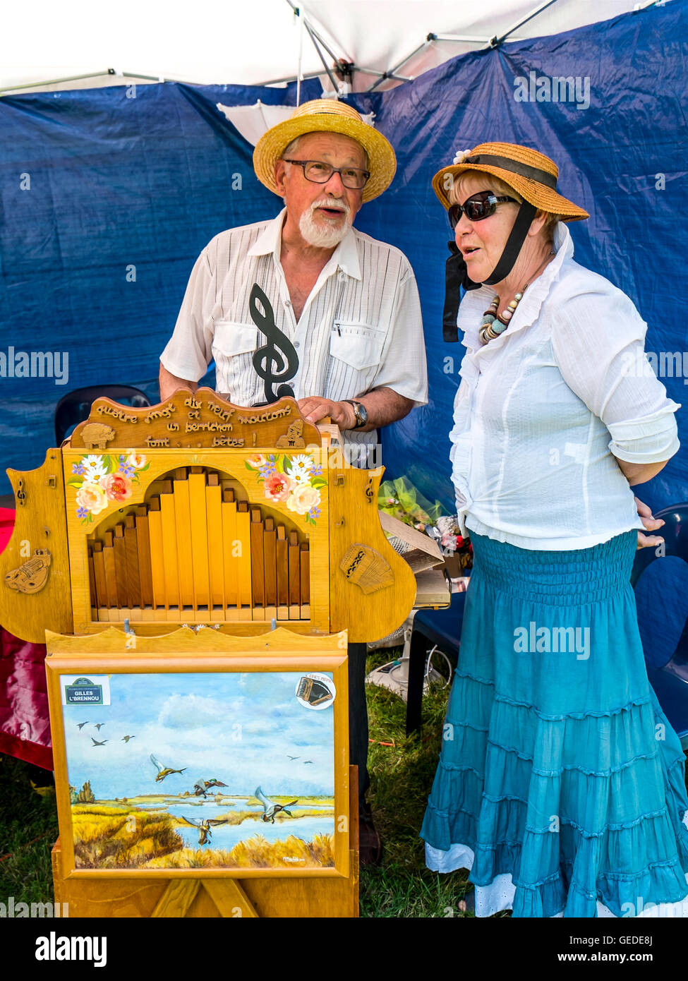 Traditional music player and singer at artist and craft fair - France. Stock Photo