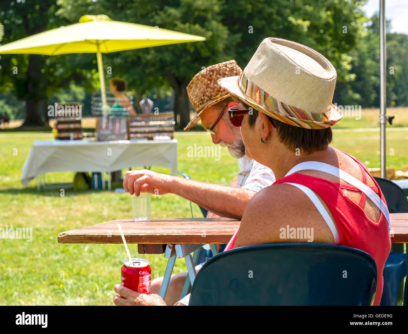 Couple relaxing at picnic table France Stock Photo Alamy