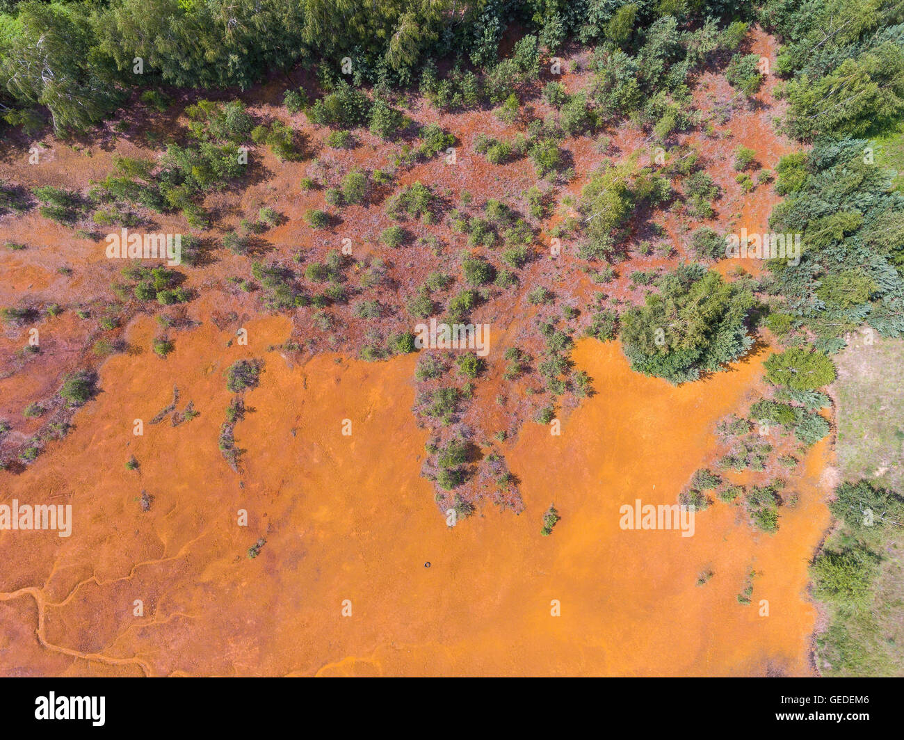 Old sulfuric acid natural tank orange color in south of Poland Stock Photo  - Alamy