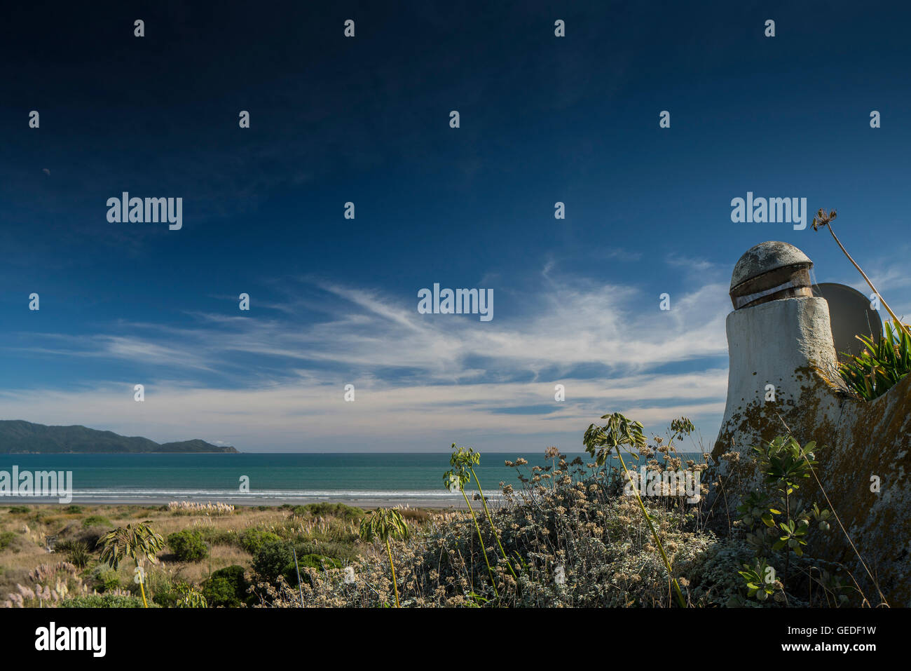 Image from roof of dome with chimney, air vent, looking across to