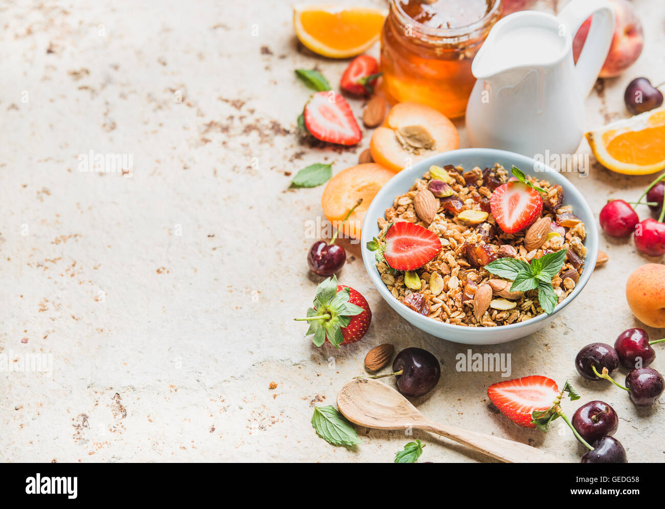Healthy breakfast ingredients. Bowl of oat granola with milk, fresh