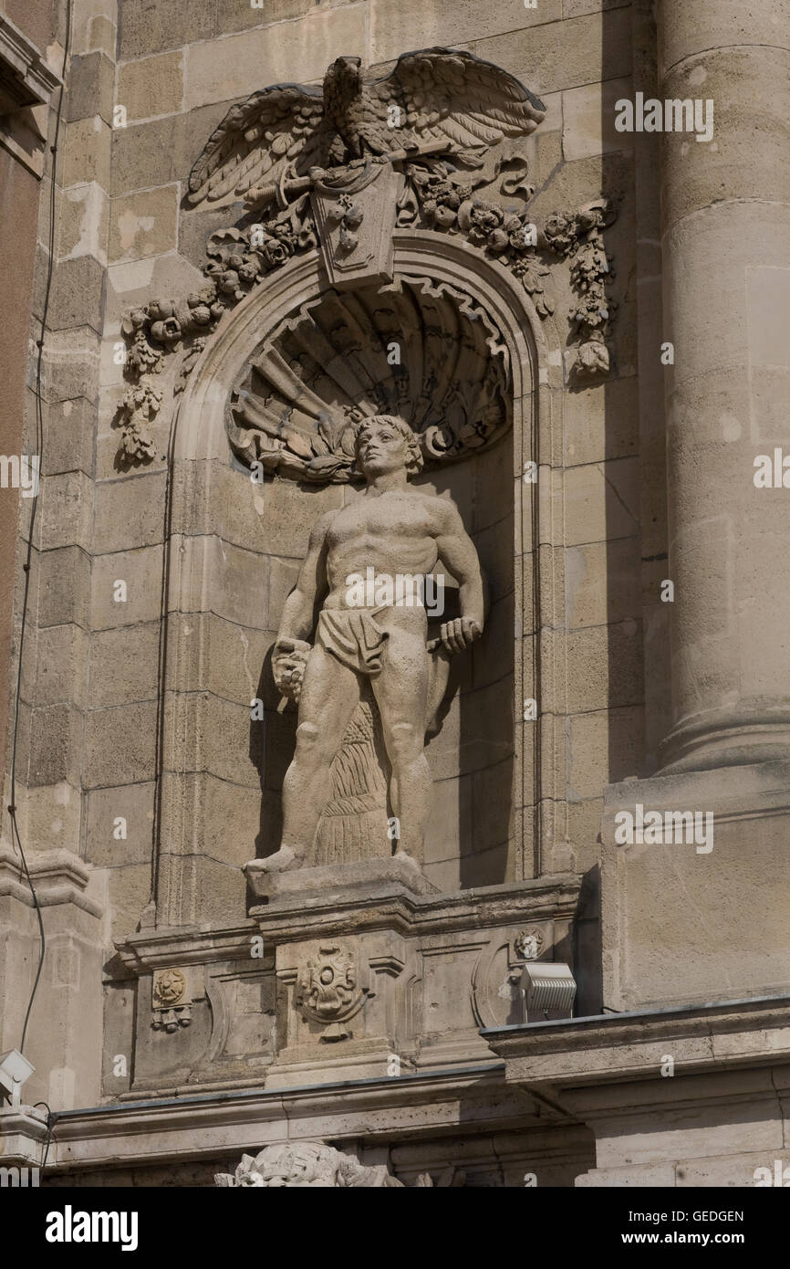 Masculine statue in wall of Royal palace Stock Photo