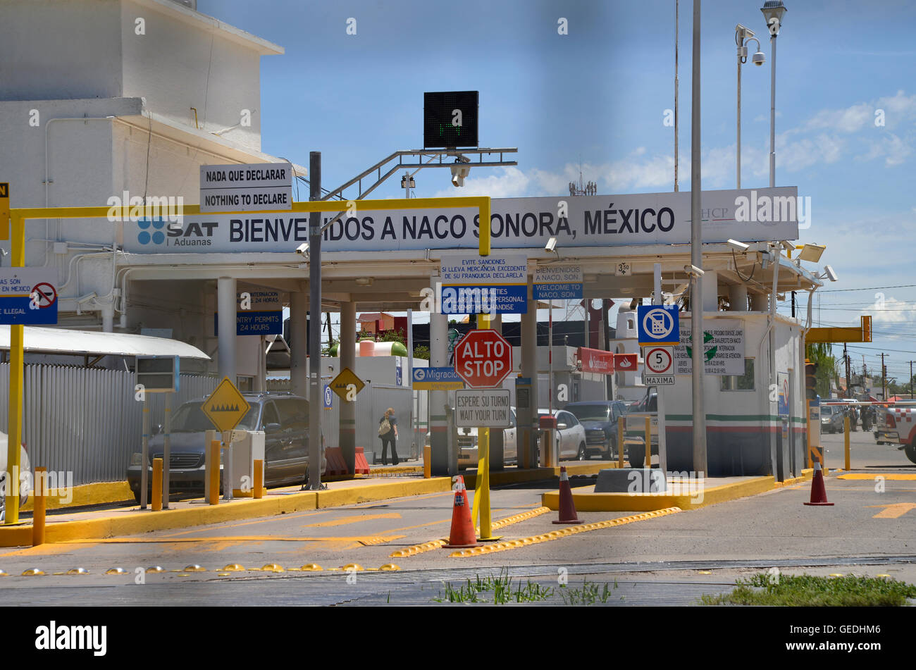 Vehicles exit the inspection station in Naco, Sonora, Mexico, and head