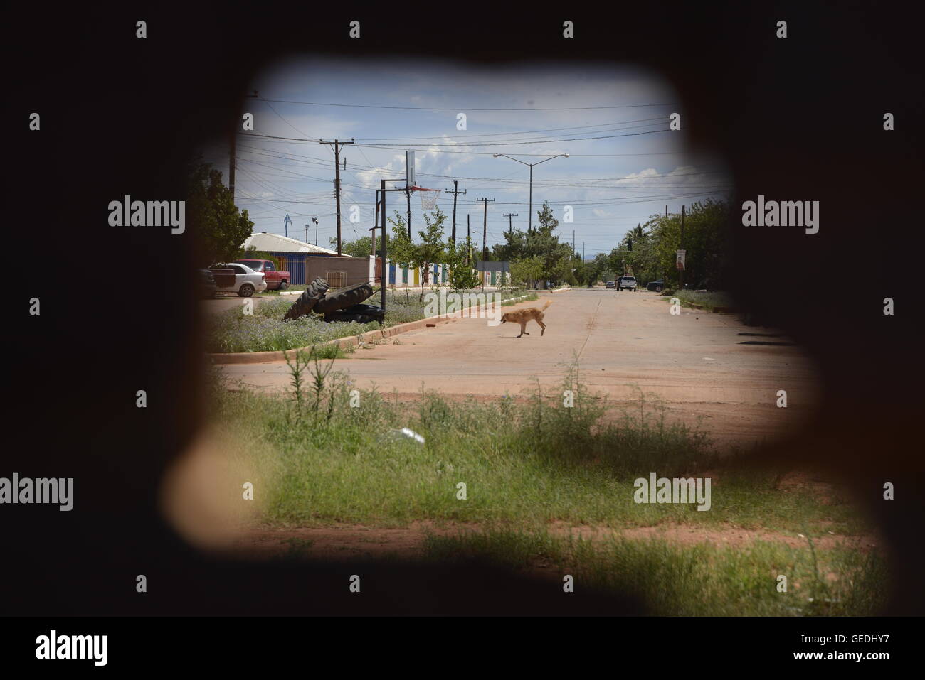 A hole in the international border wall between Naco, Arizona, USA and