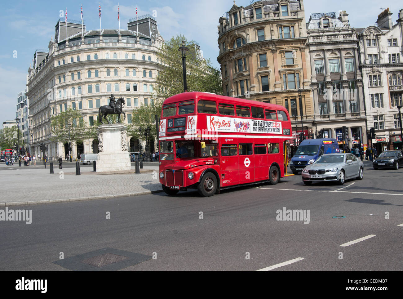 An AEC Routemaster bus operated by Stagecoach London on heritage route 15 passes the statue of King Charles I in Trafalgar Sqr. Stock Photo