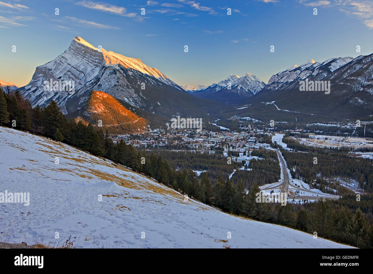 geography / travel, Canada, Alberta, 4 km NW of Banff, Town of Banff viewed from Norquay Meadow along Mount Norquay Road during winter after snow fall with Mount Rundle (2949 metres/9 Stock Photo