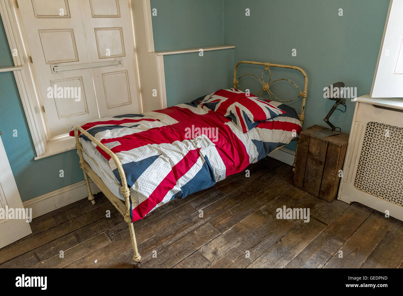 Union Jack Quilt Cover And Pillow Case On A Metal Framed Single