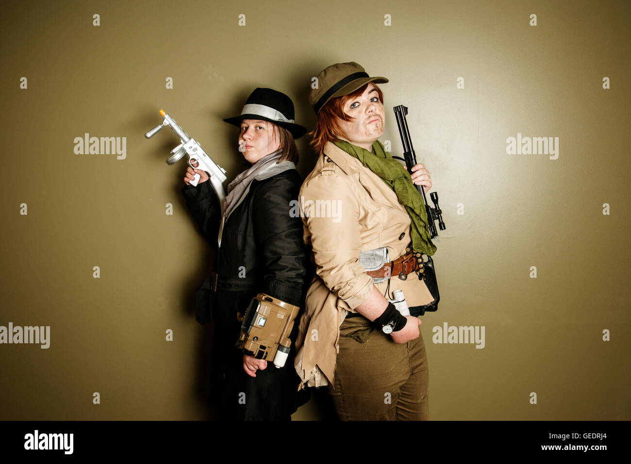 Two female Cosplayers dressed as characters from the video game , Fallout 4  pose for photographs at a Comic Con convention Stock Photo - Alamy
