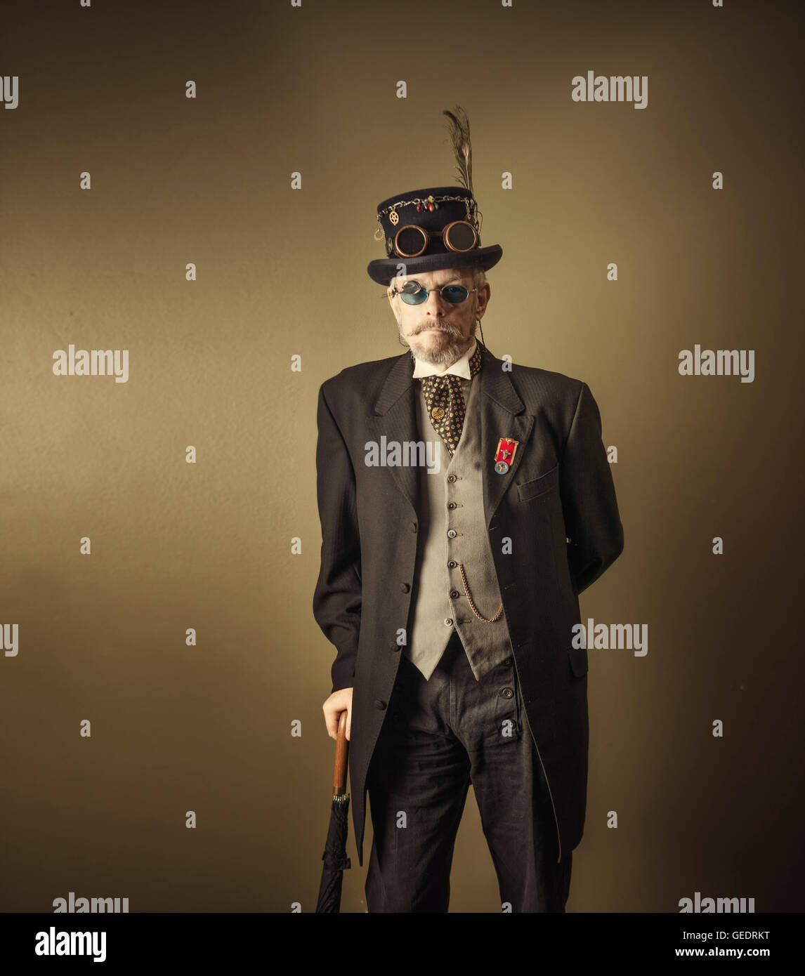Cosplayers dressed as a steampunk poses for photographs at a Comic Con convention. Stock Photo