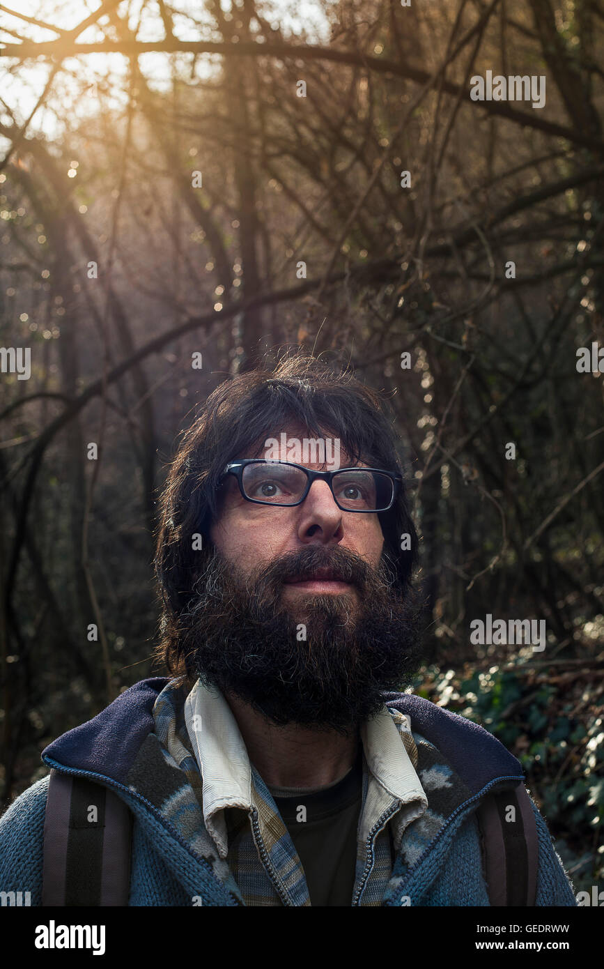 Head and Shoulders Portrait of Bearded Man Standing in Woods Stock Photo