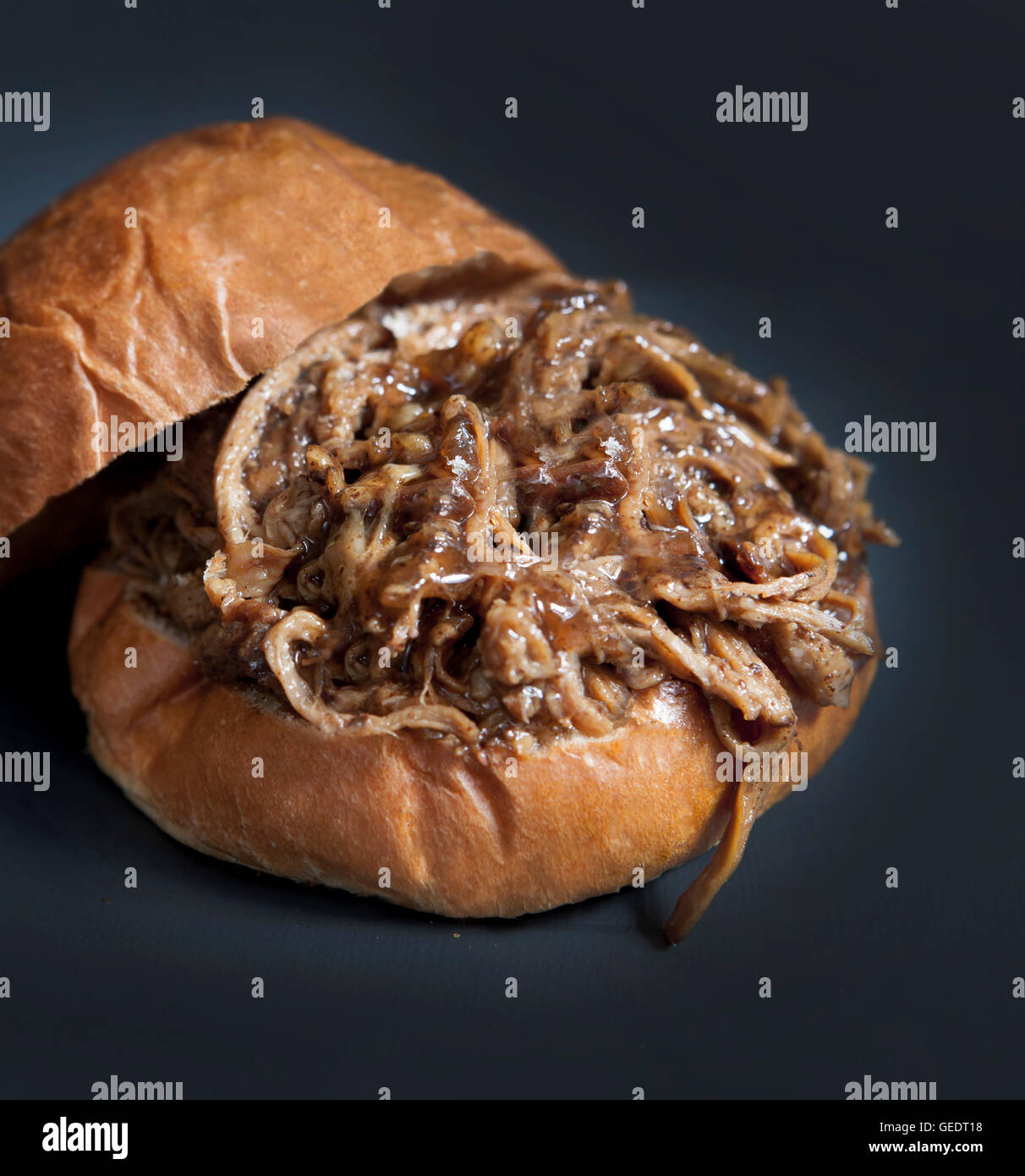 Homemade Barbeque Pulled Pork Sandwich on Bun Stock Photo