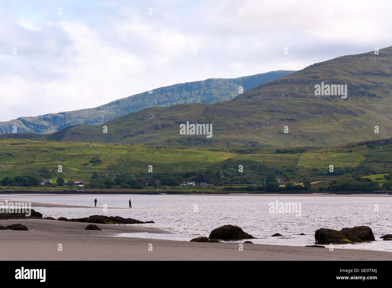 Two men fishing in Atlantic Ocean near Ardara, County Donegal, Ireland Stock Photo