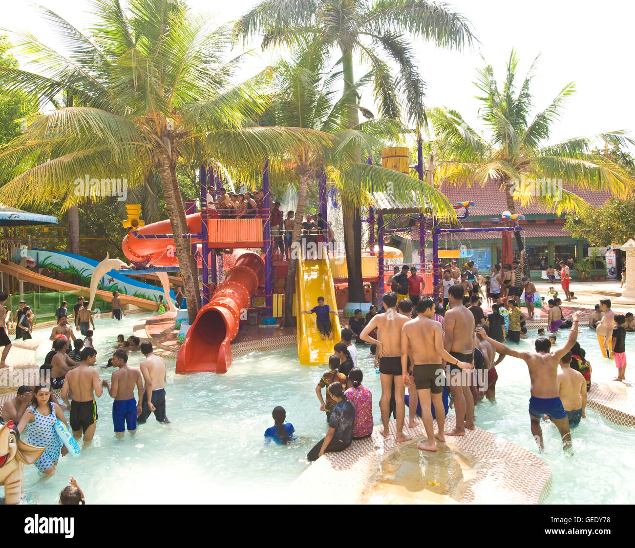 Though there may be water supply issues in the city Water Kingdom part of Essel world amusement park in Gorai, Mumbai, India is undiminished and attracted large crowds over the long weekend.     Water Kingdom is said to be Asia's largest theme water park and has several attractions including the world's biggest wave pool, heart stopping rides 'n' slides, river adventure cruises etc     Attractions of Water Kingdom:   The Wet Atlantic-The world's biggest wavepool   Misphisly Hill-12 hi-speed thrilling rides   Brat Zone-geysers, button-operated water games, jets for kids   Goofers Lagoon- The pe Stock Photo