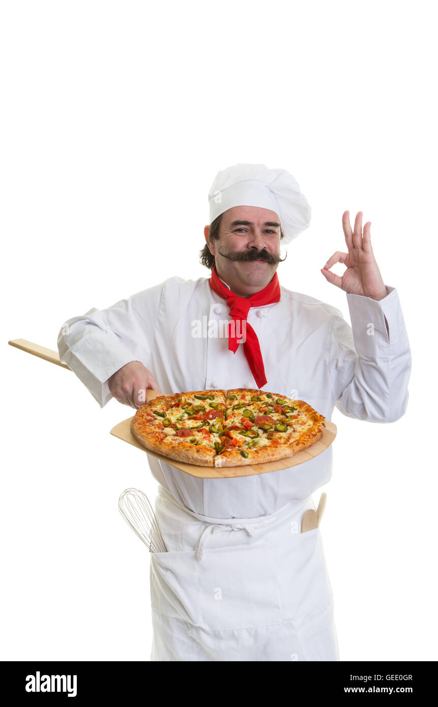 Italian Chef holding a pizza on a peel showing his approval Stock Photo