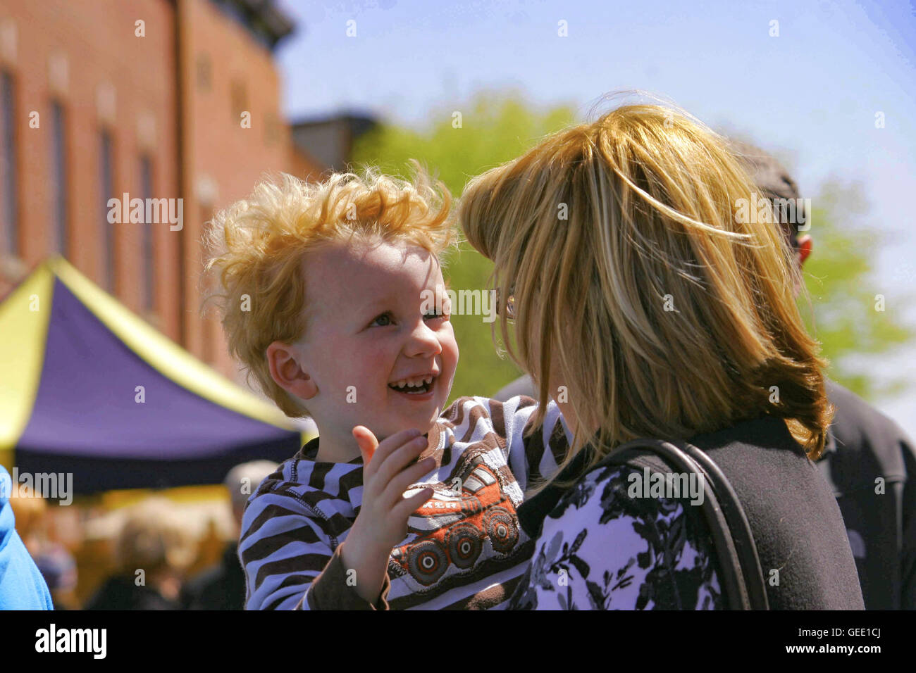 Berlin Maryland Spring Festival  Little boy and grandma share a moment amidst the throng of Main Street  revelers Stock Photo