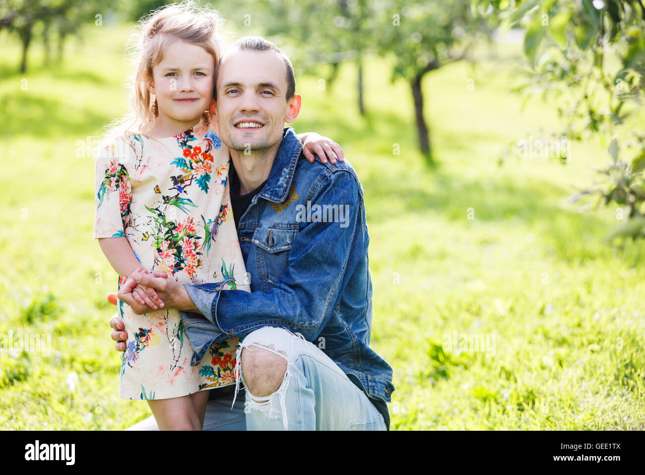 Father and daughter in green park Stock Photo - Alamy
