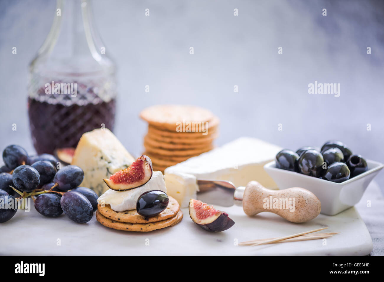 crackers with selection of cheese,grapes,olives and fig Stock Photo Alamy