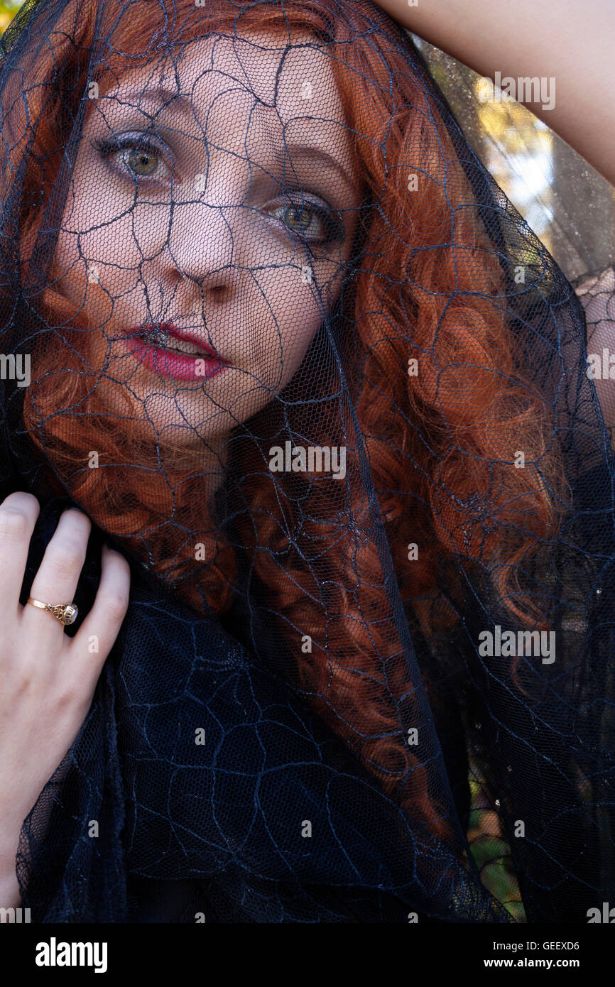 Woman in with black veil Stock Photo - Alamy