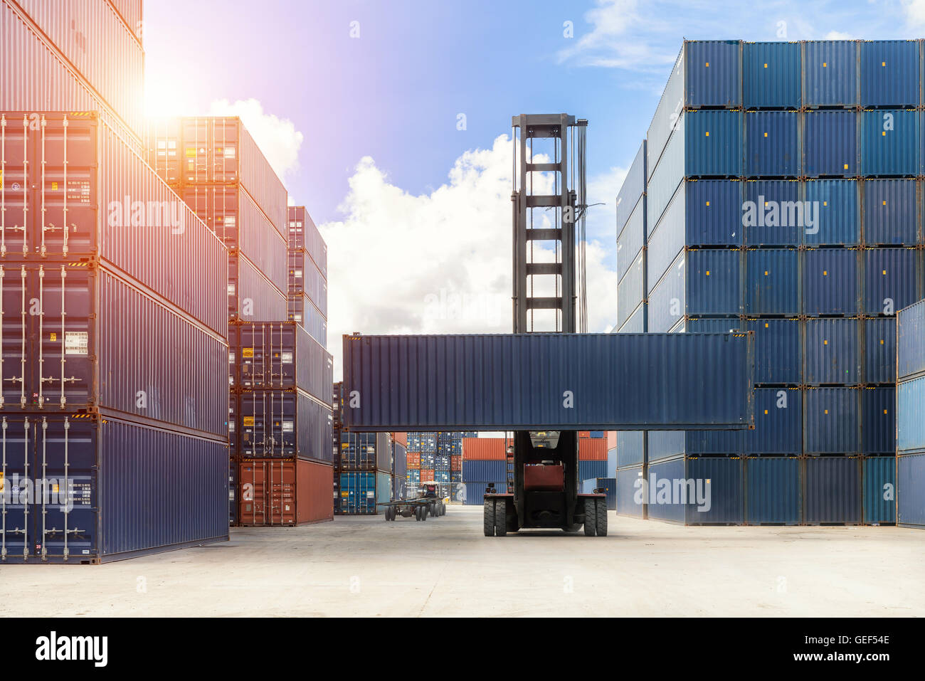 Import, Export, Logistics concept - Crane lift up container box loading to container depot Stock Photo