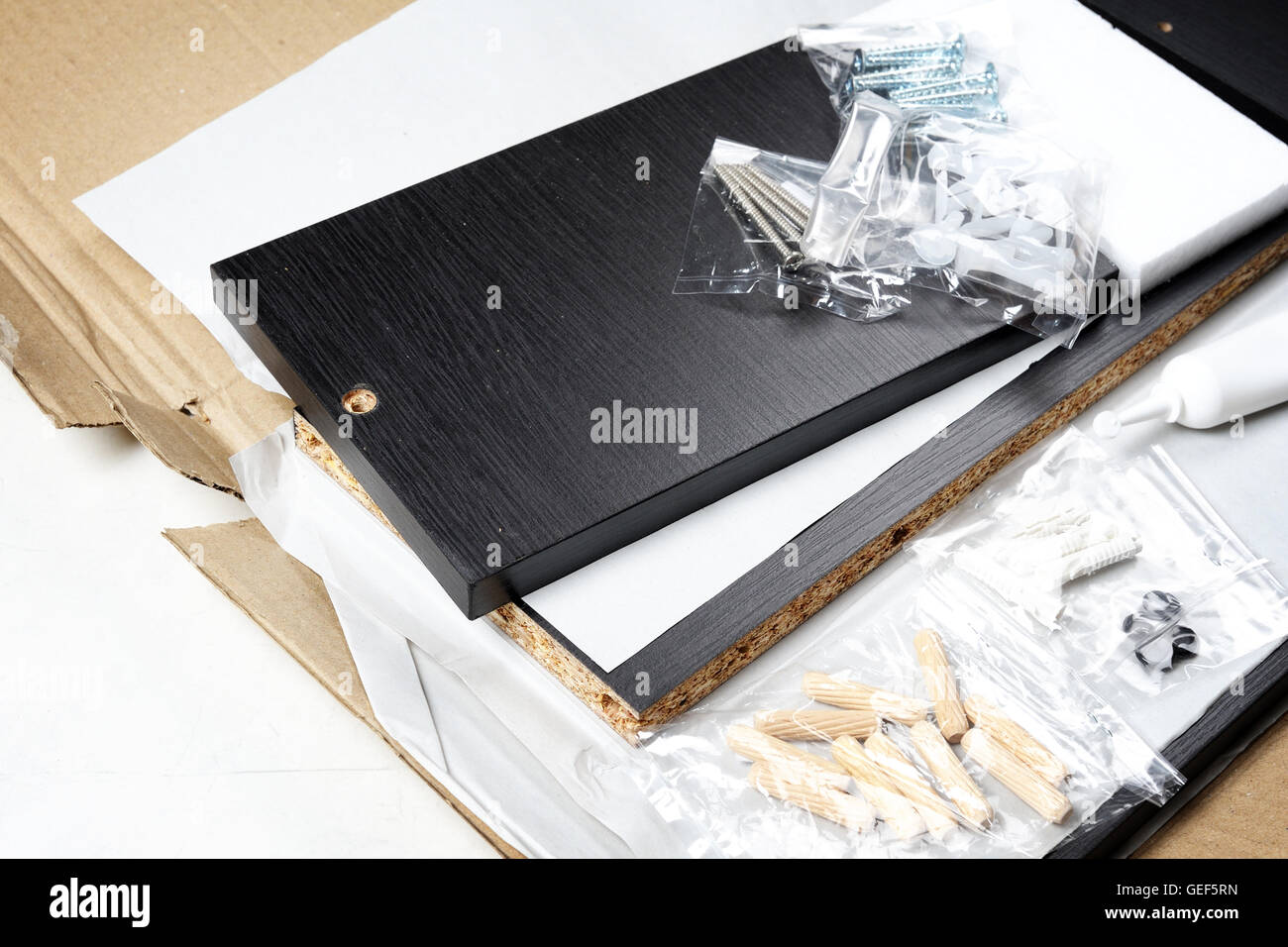 unboxing the furniture, preparing to install Stock Photo Alamy