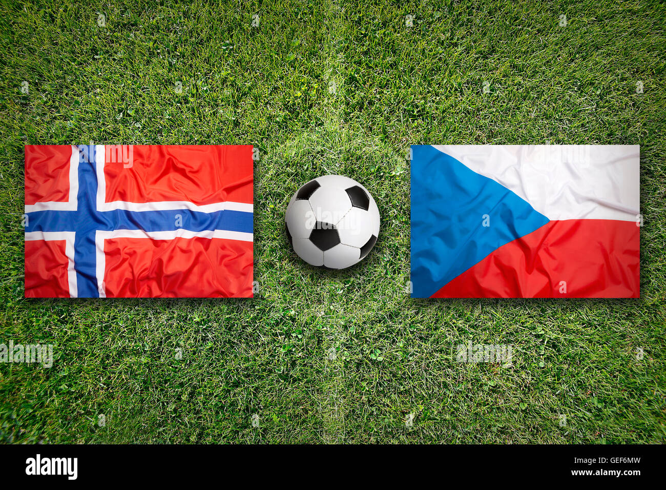 Norway vs. Czech Republic flags on green soccer field Stock Photo