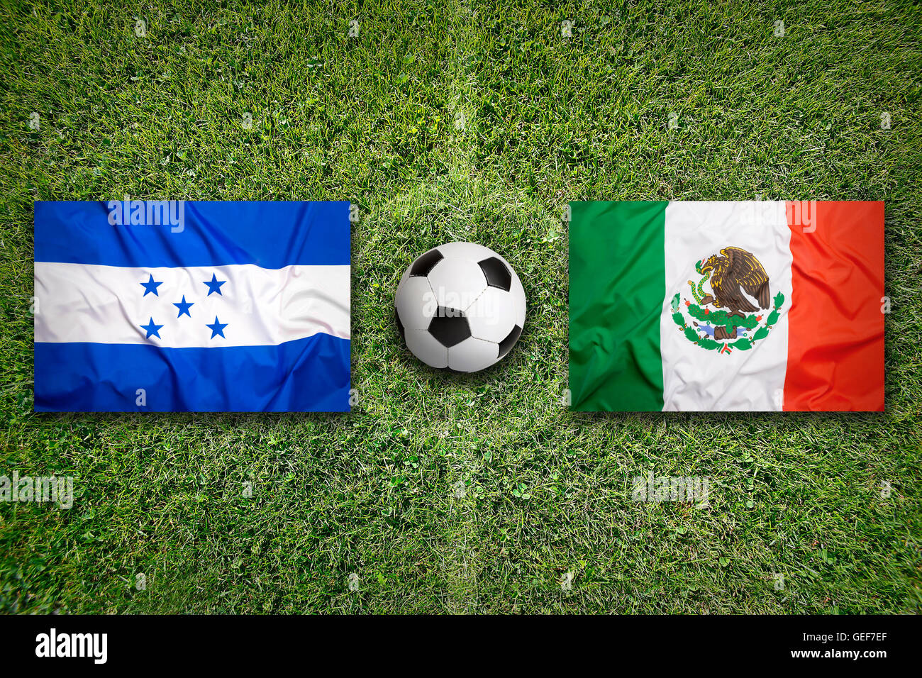 Honduras vs. Mexico flags on green soccer field Stock Photo Alamy