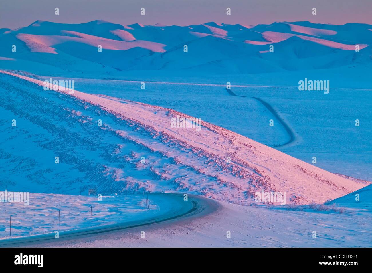 geography / travel, Canada, Yukon Territory, View down the Dempster Highway leading towards the Richardson Mountains in winter, Stock Photo