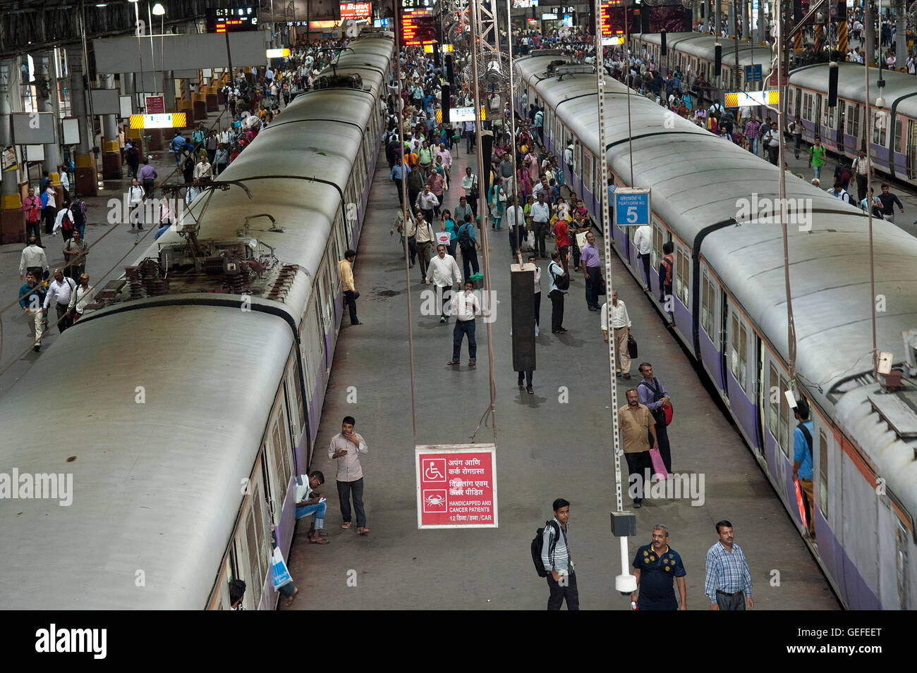 The image of Local train and commuters at CST station building or VT