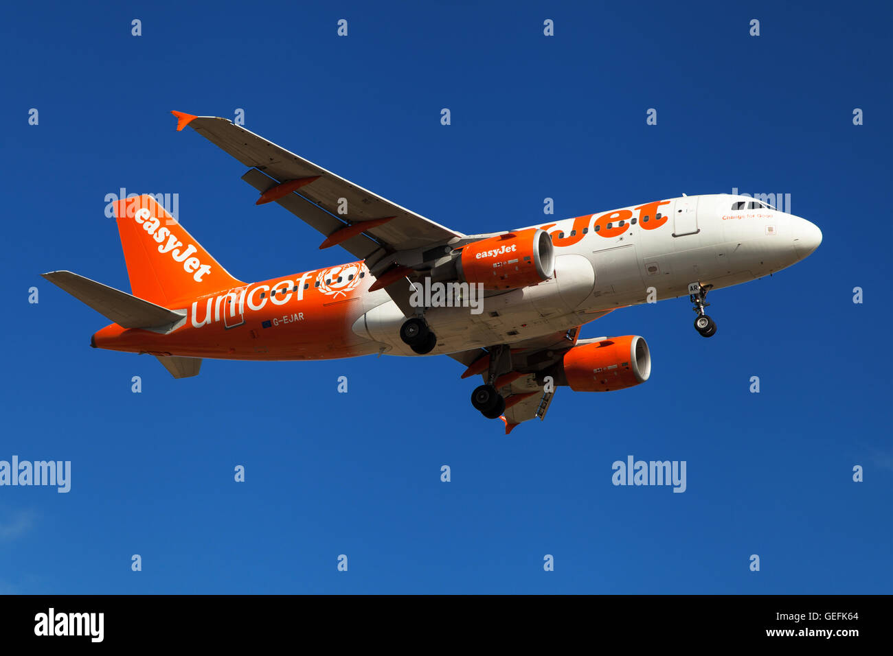 An Easyjet Airbus A319-100 wearing Unicef special livery approaching to El Prat Airport in Barcelona, Spain. Stock Photo
