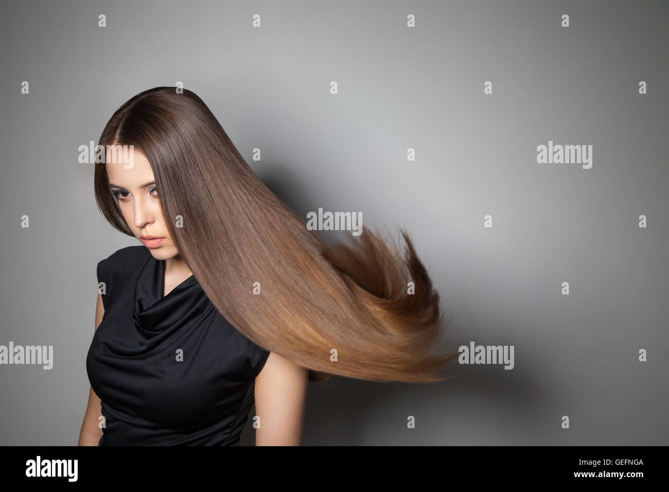 Beautiful model with smooth flying hair Stock Photo