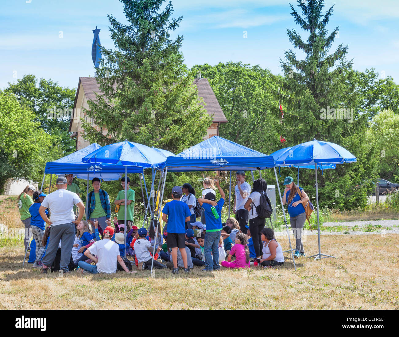 Group of school children on field trip in a outdoor nature park on