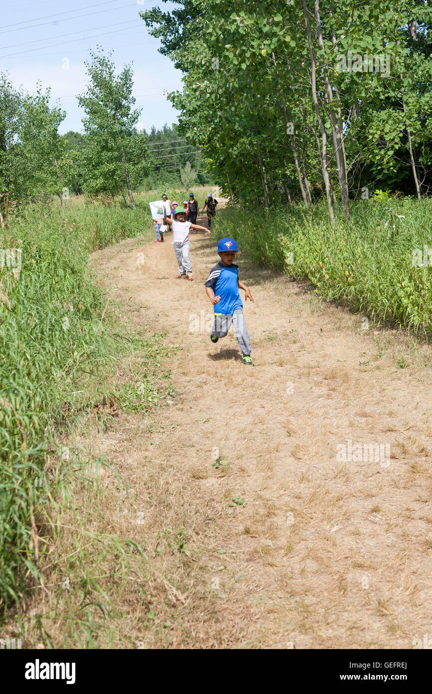 Children playing,hiking and having fun in a outdoor nature park on