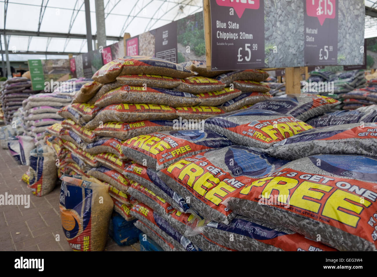 Bags of decorative gravel on sale at a garden centre Stock Photo Alamy