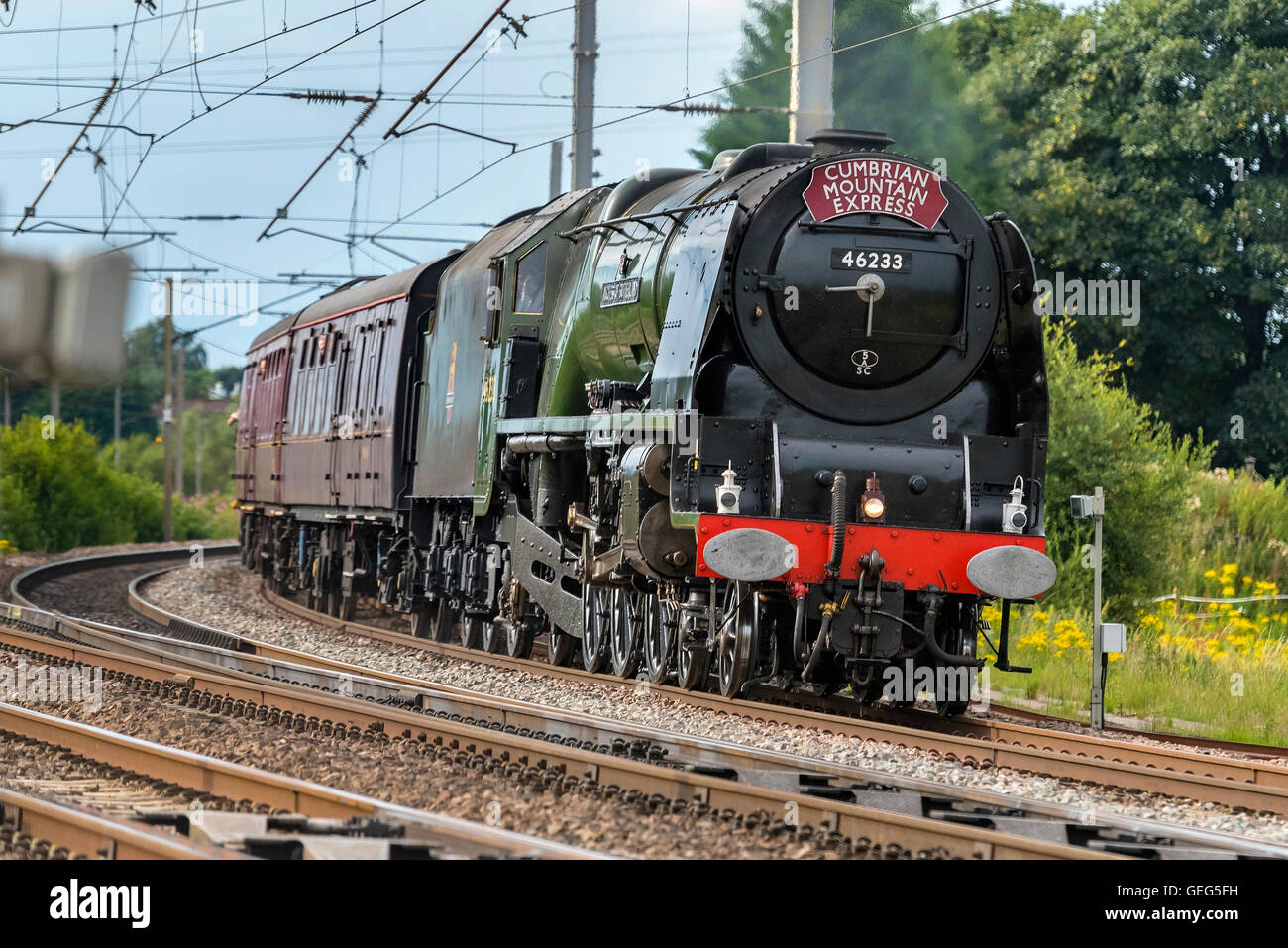 Princess Elizabeth Class locomotive The Duchess of Sutherland hauling the Cumbrian Mountain Express at speed  passing Winwick Stock Photo