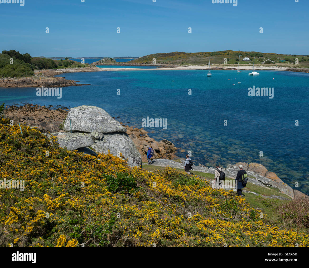 Hikers on St Agnes, Isles of Scilly. Cornwall. England. UK Stock Photo