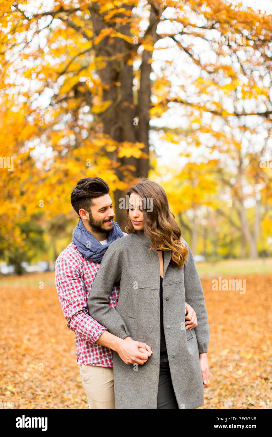 Loving young couple in the autumn park Stock Photo - Alamy