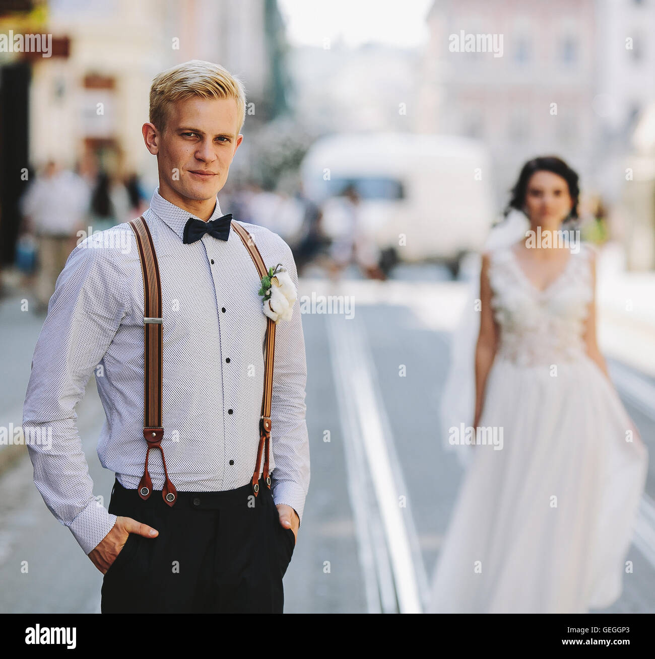 bride and groom on the street Stock Photo - Alamy