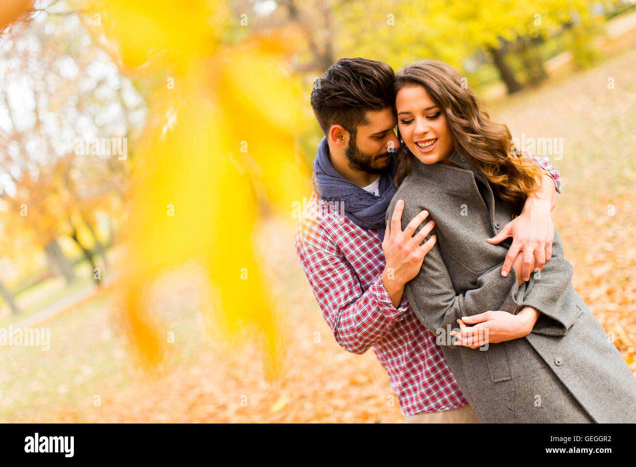 Loving young couple in the autumn park Stock Photo - Alamy