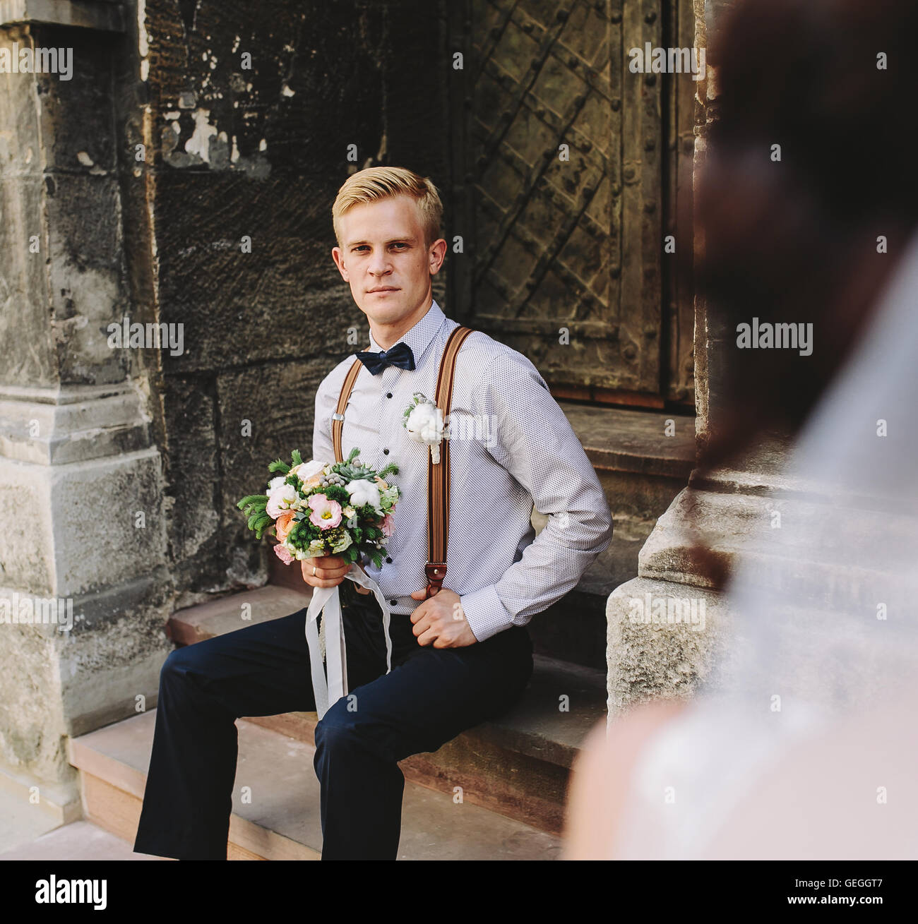 bride sitting on stone steps Stock Photo - Alamy