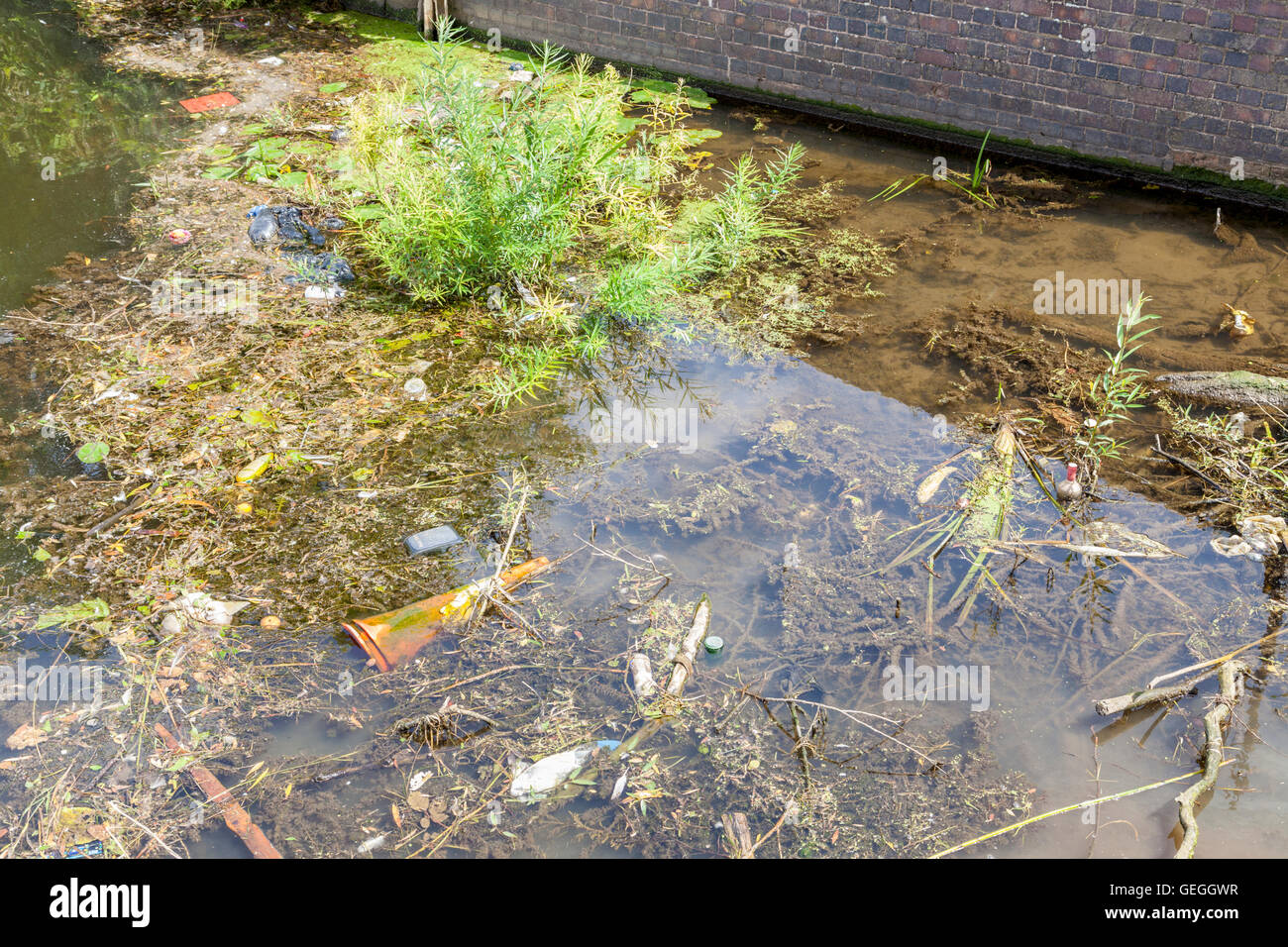 Waterways pollution. Rubbish in the disused Grantham Canal, West Bridgford, Nottinghamshire, England, UK Stock Photo