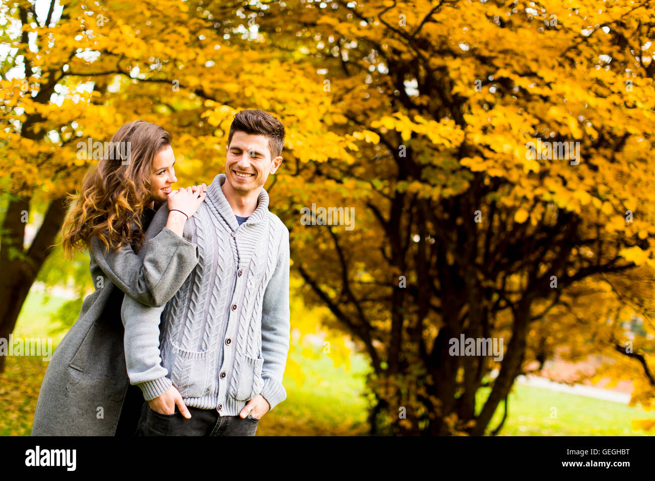 Loving young couple in the autumn park Stock Photo - Alamy