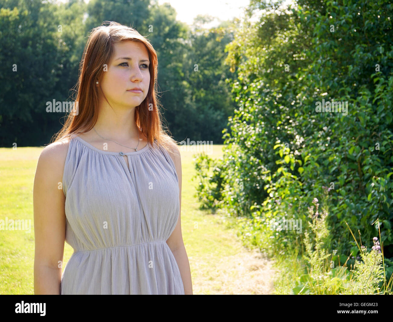 young woman in a park Stock Photo - Alamy