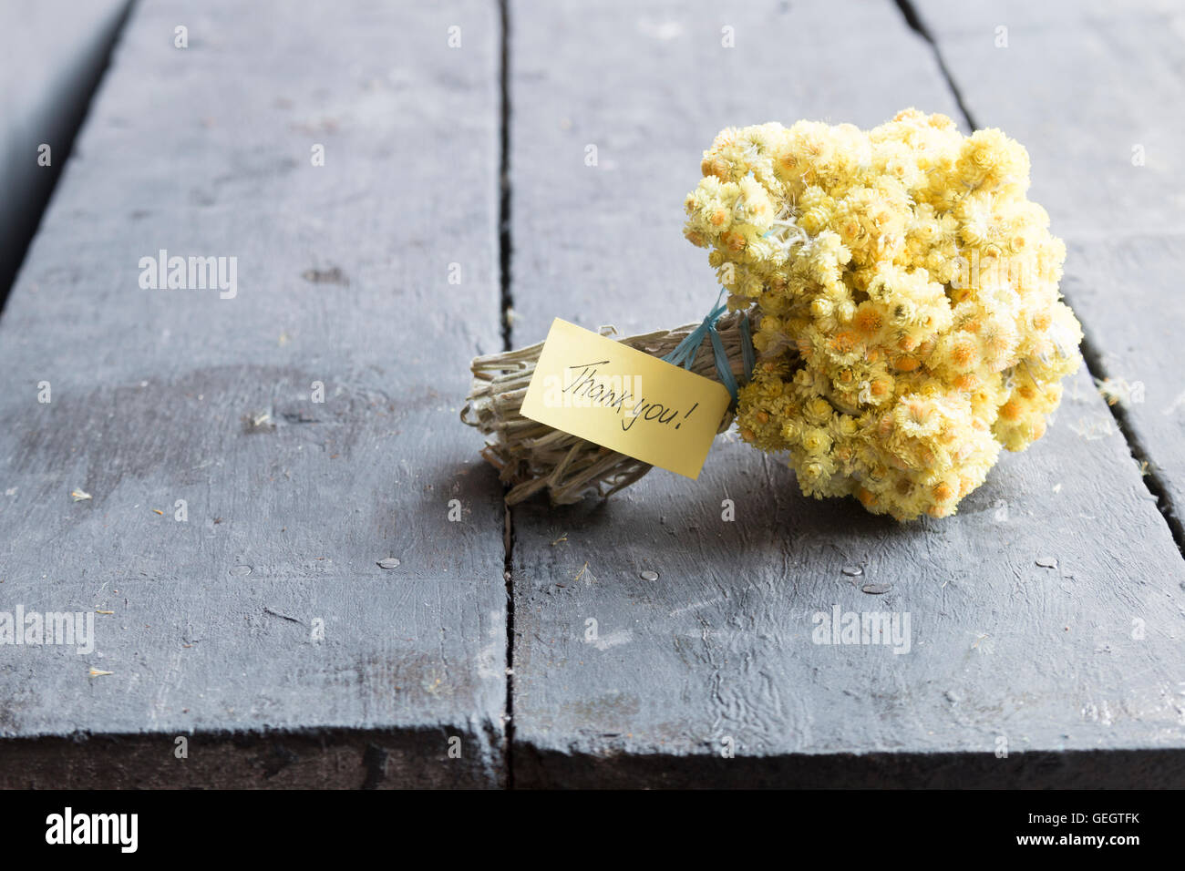 label with thank you inscription and flower bouquet Stock Photo