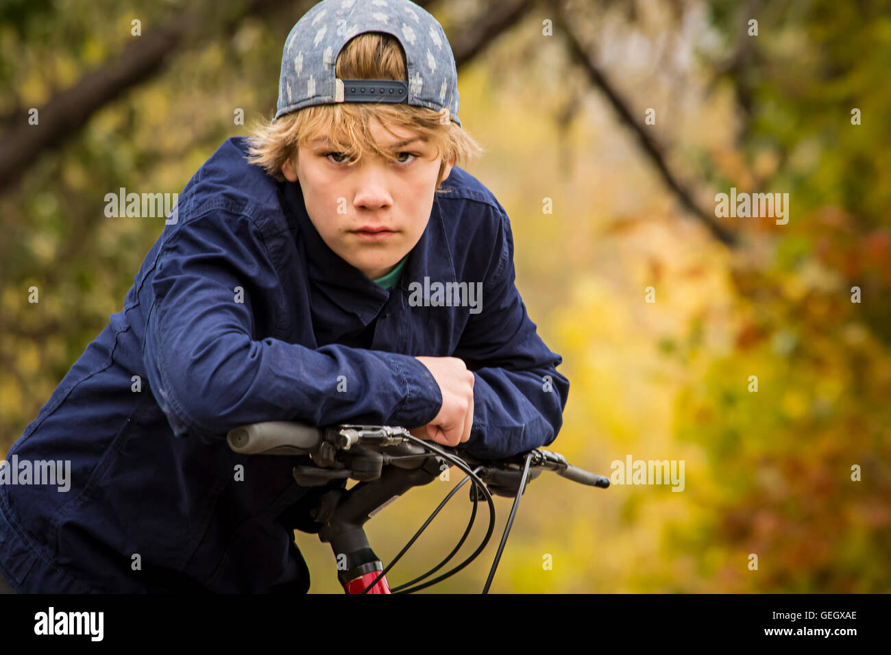 a teenage boy his bicycle Stock Photo