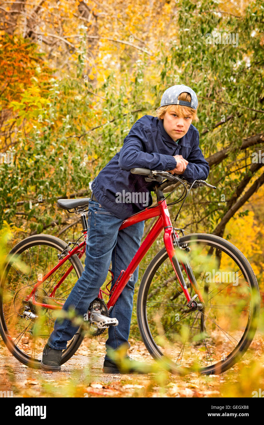 teenager on a red bicycle i Stock Photo